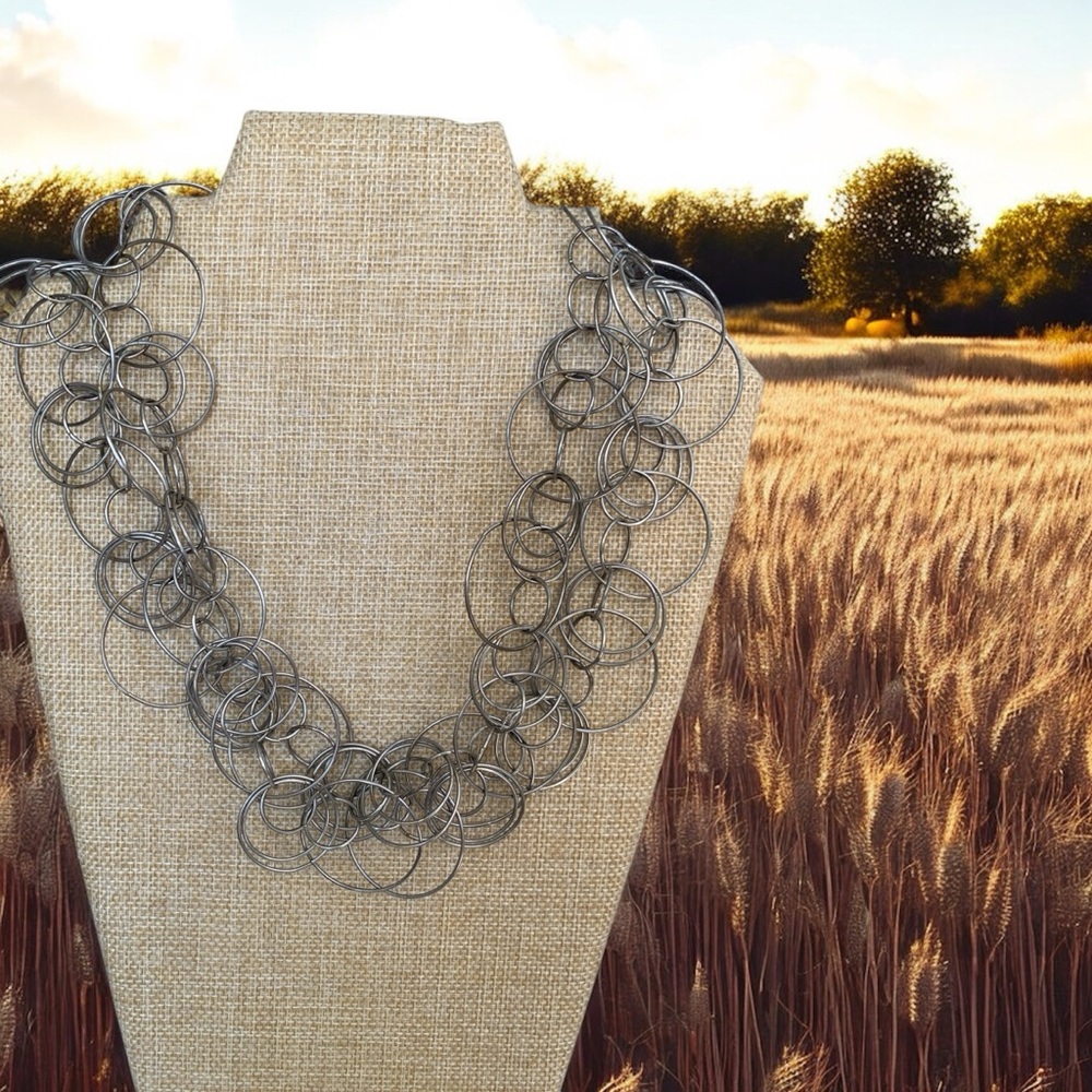 Intricate Silver Tone Necklace with Layered Circular Design